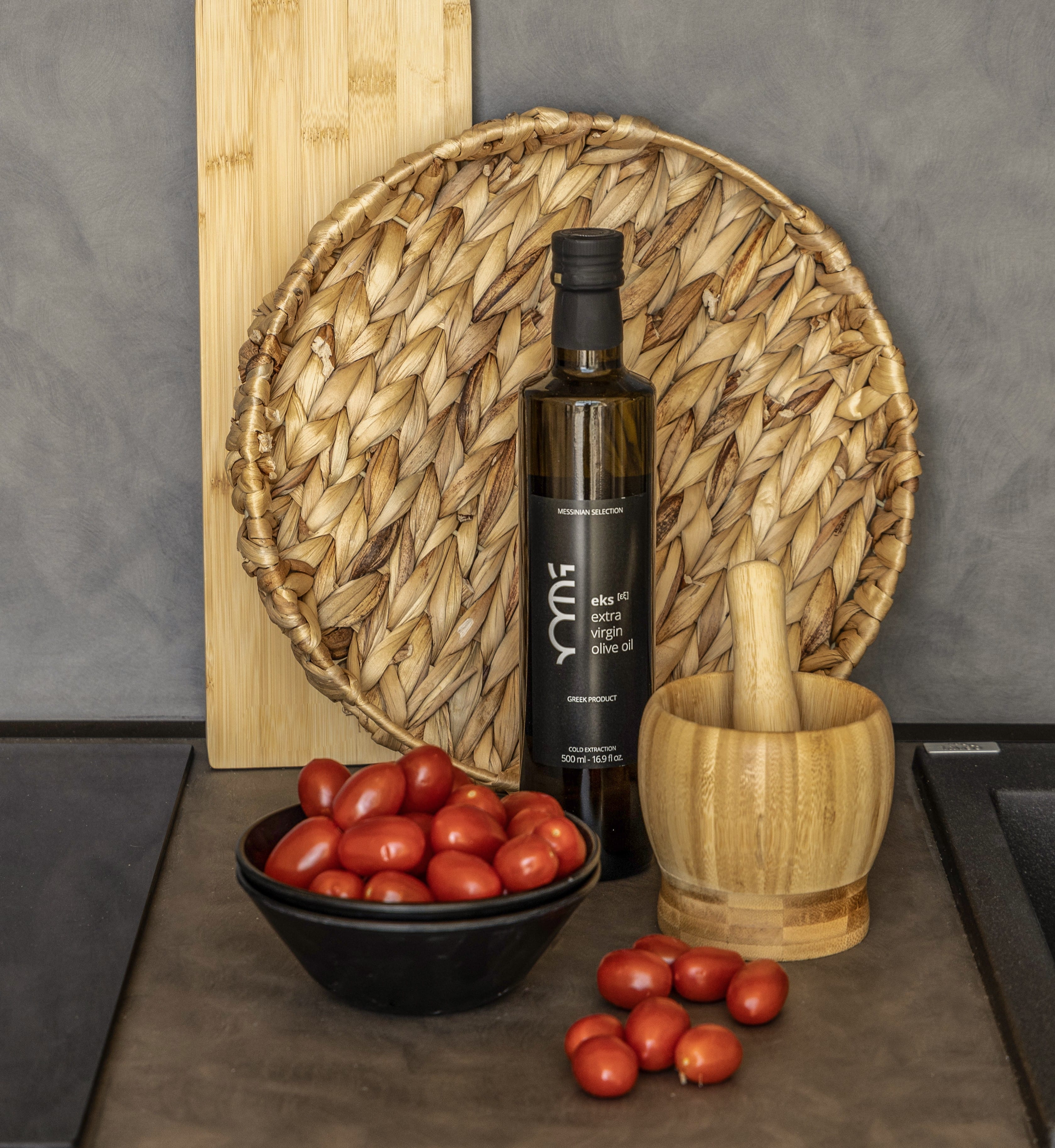 a bowl of tomatoes and a mortar