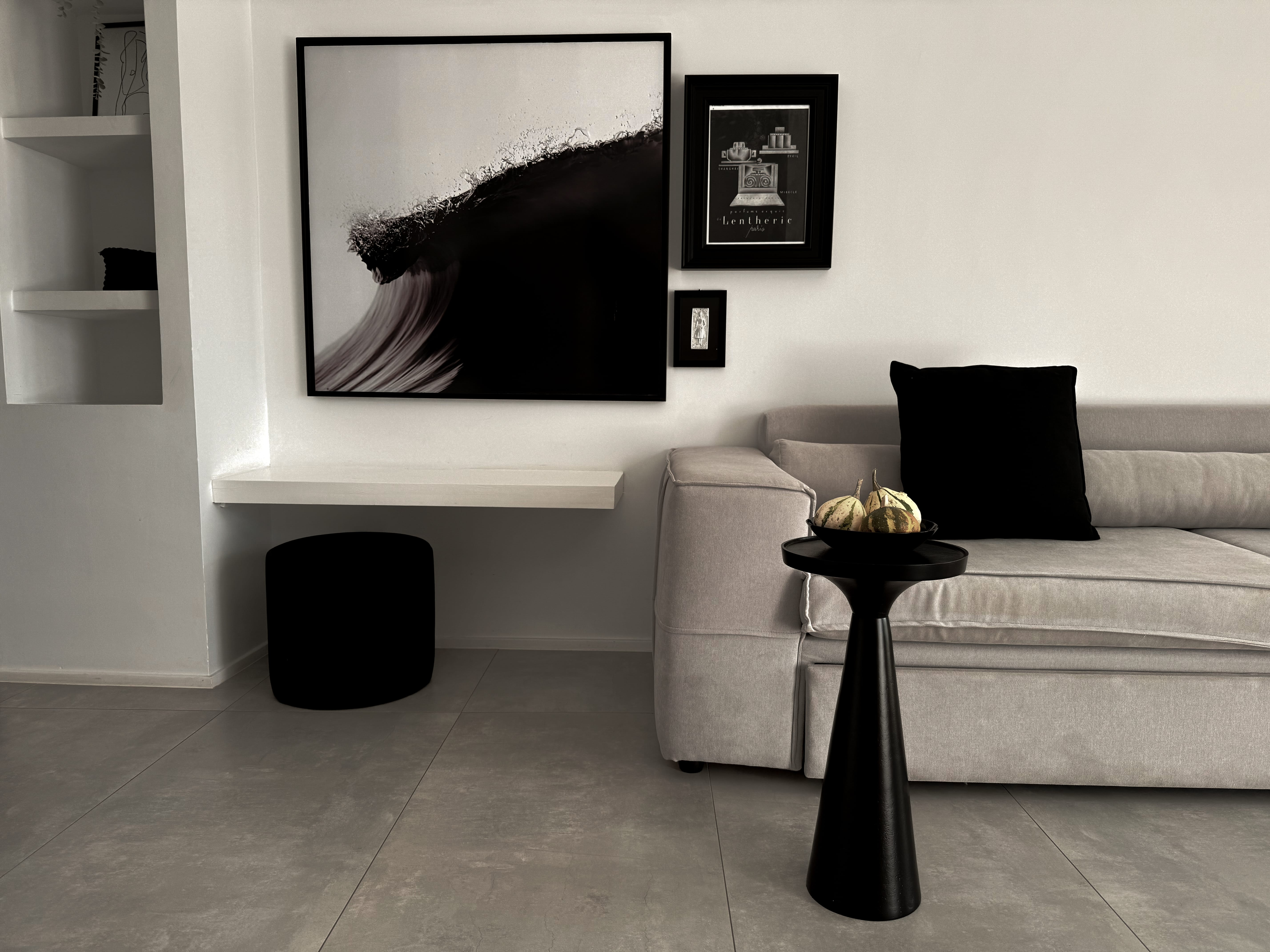 a room with a couch and a table with a bowl of food