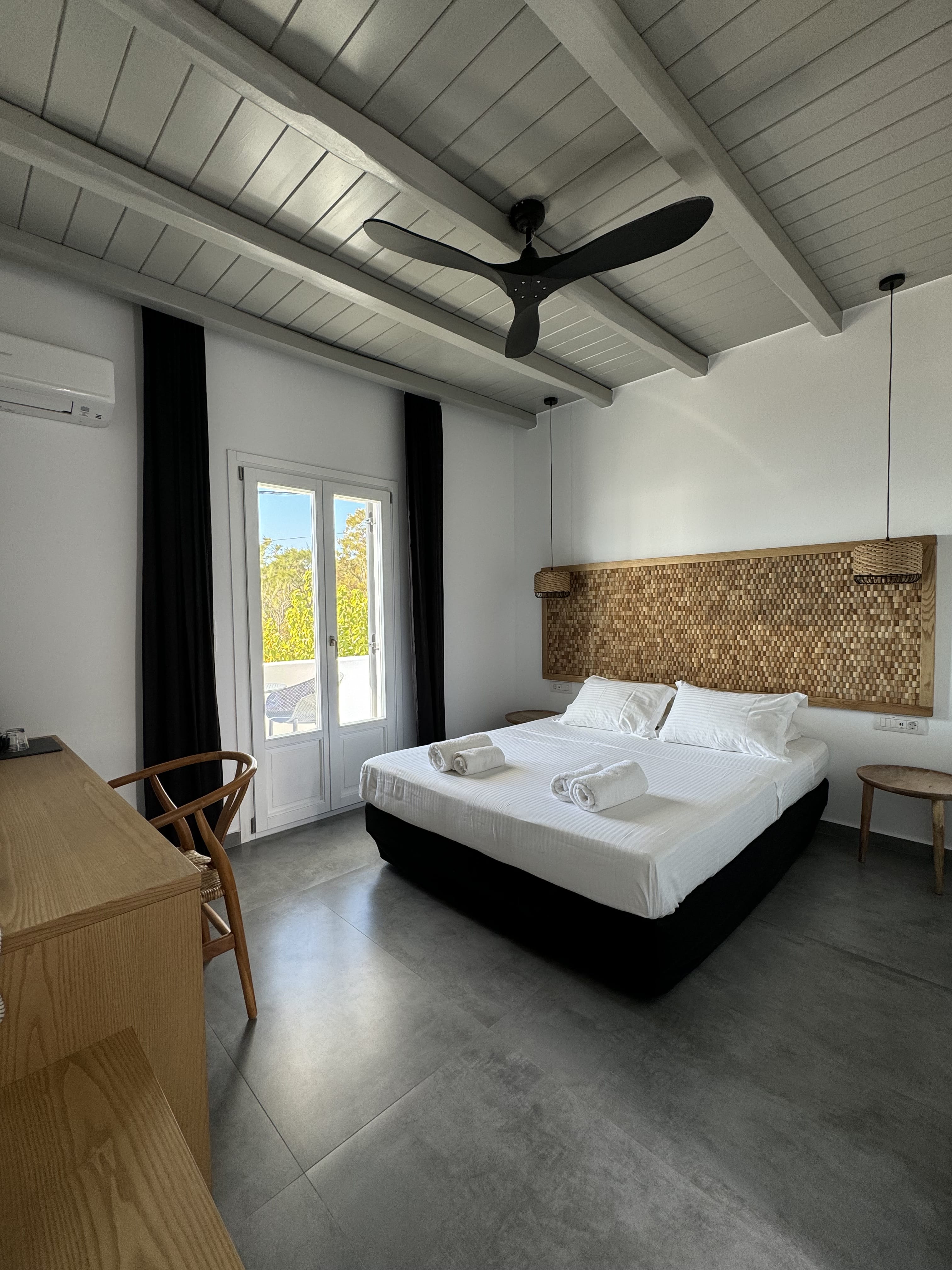 a bedroom with a bed and a table