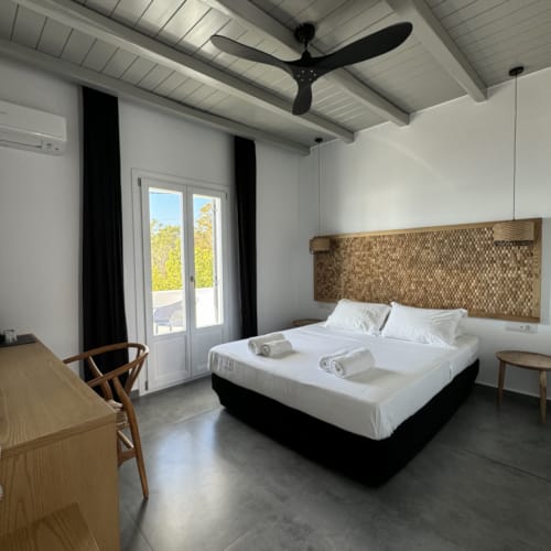 a bedroom with a bed and a table