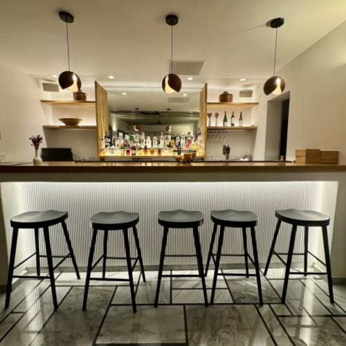 a kitchen with stools