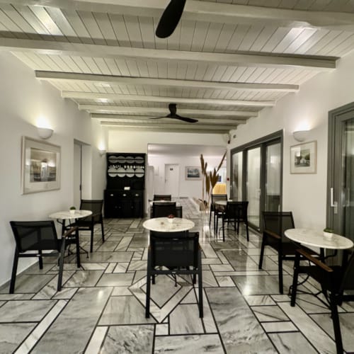 a room with tables and chairs