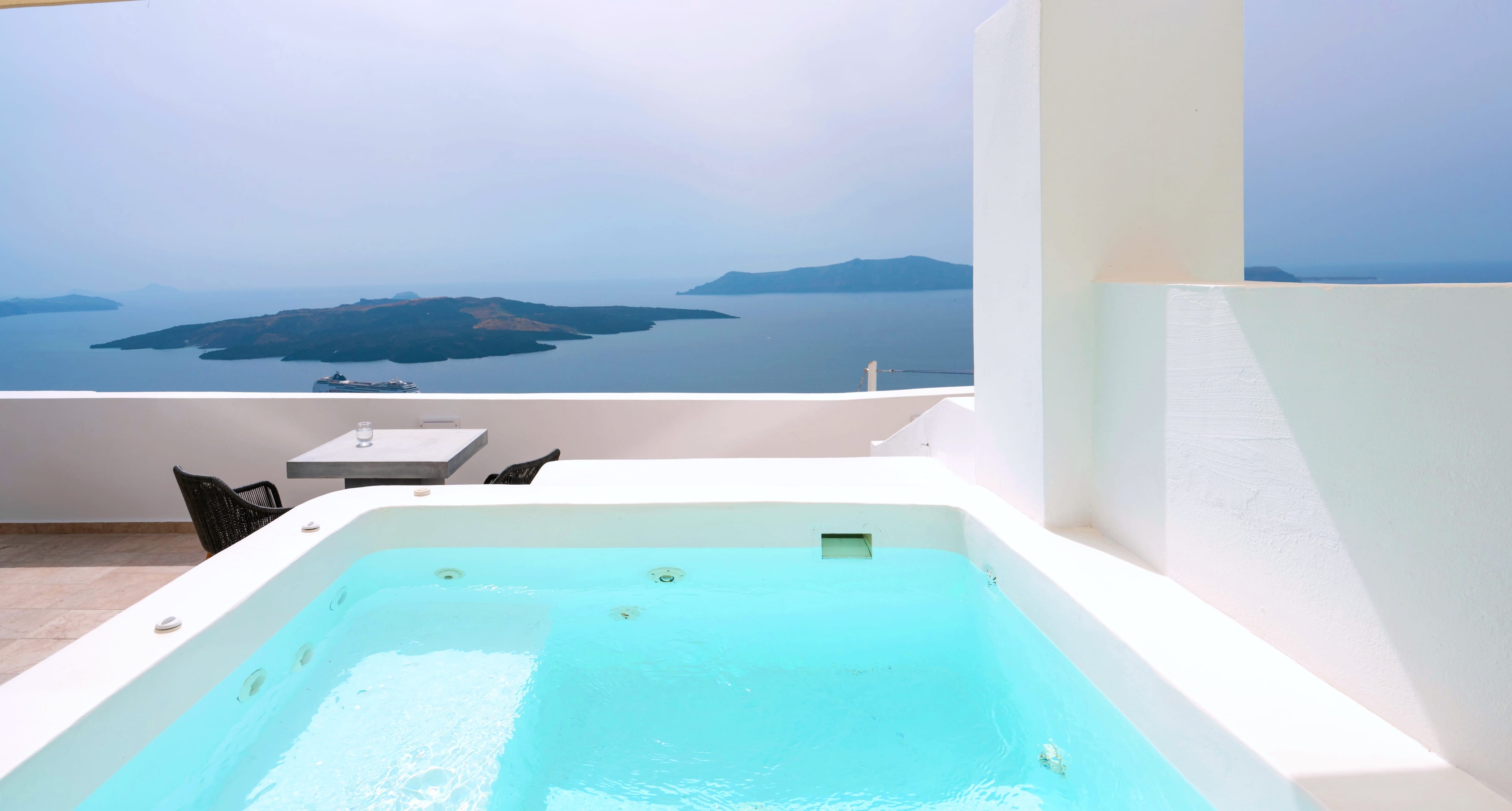 a pool with a boat in the background