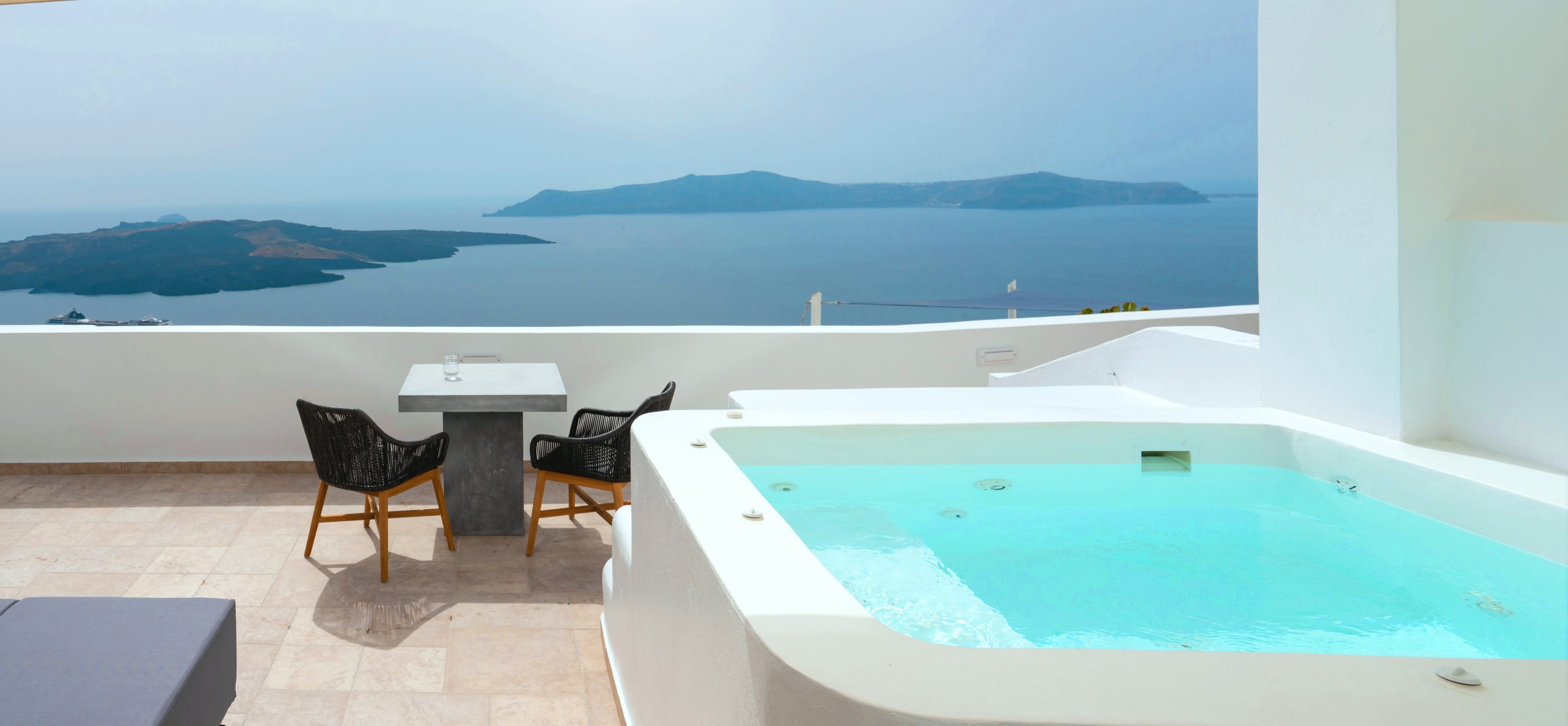 a pool with chairs and a table