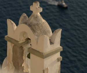 a statue of a person on a boat in the water