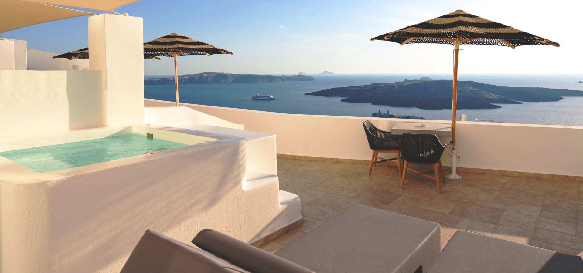 a pool and chairs on a deck