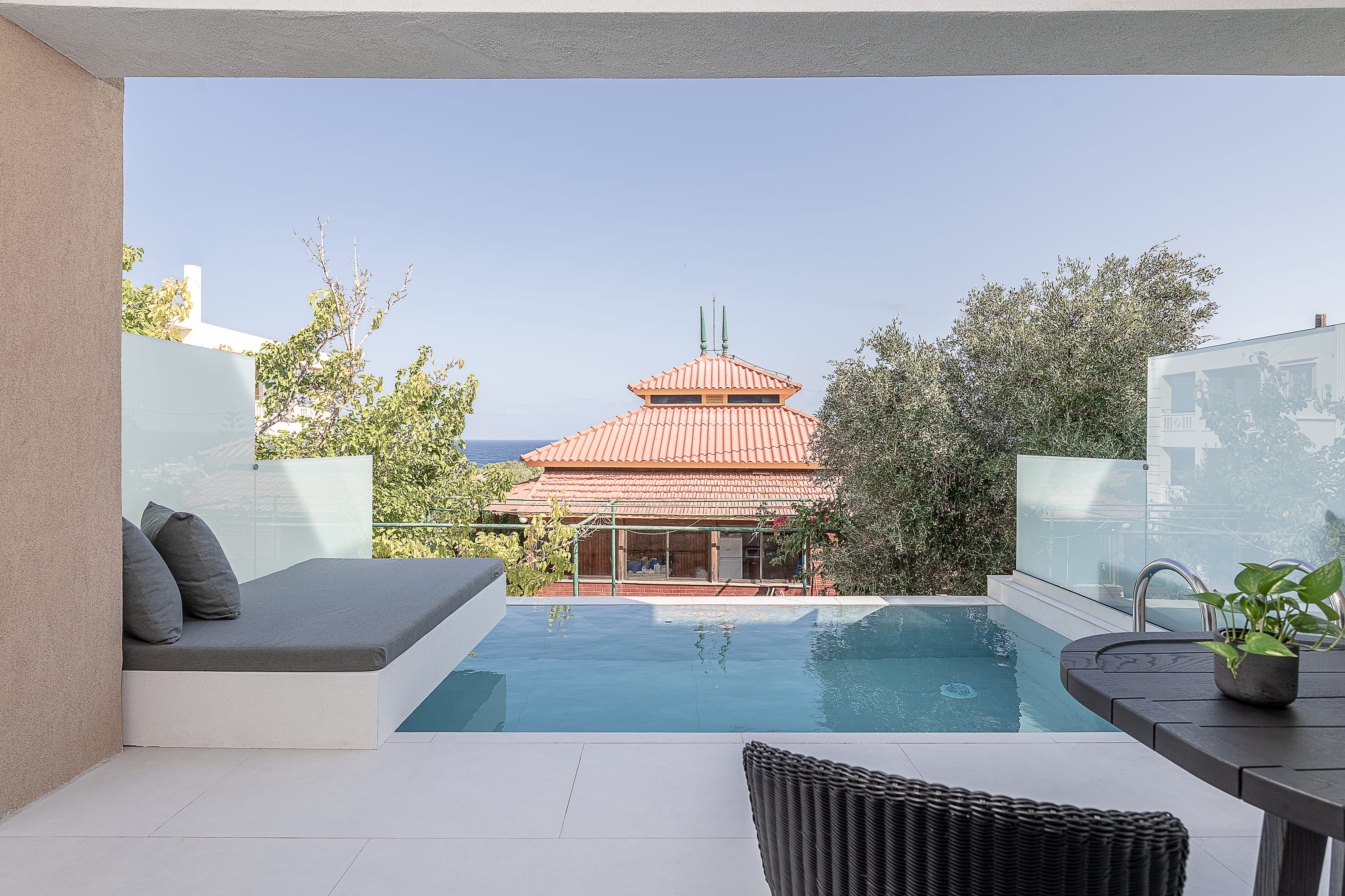 a pool with a house in the background
