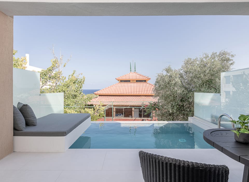 a pool with a house in the background