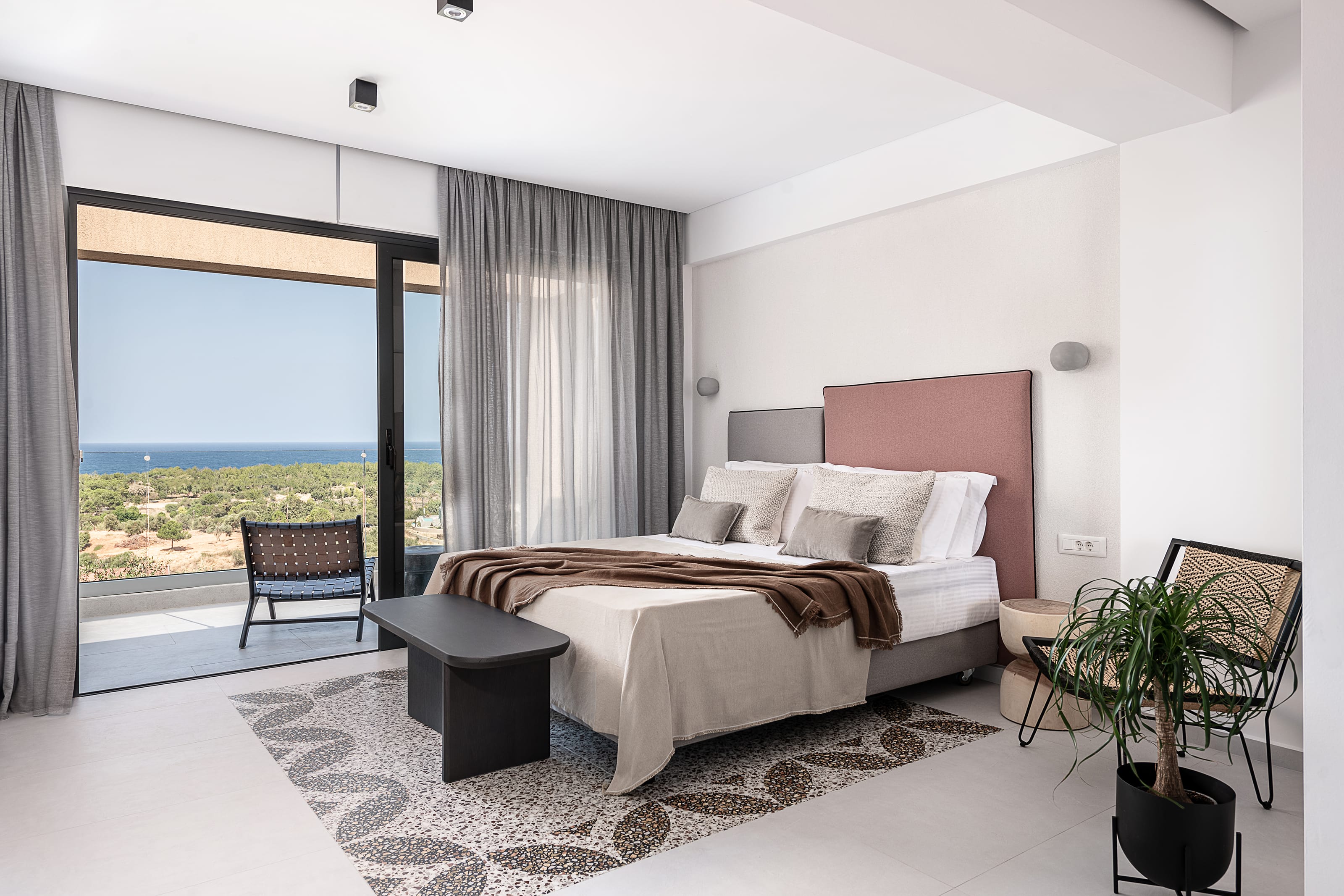 a bedroom with a large window