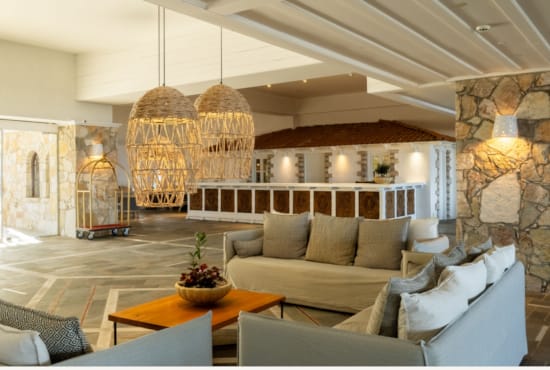 a living room with a chandelier and a couch