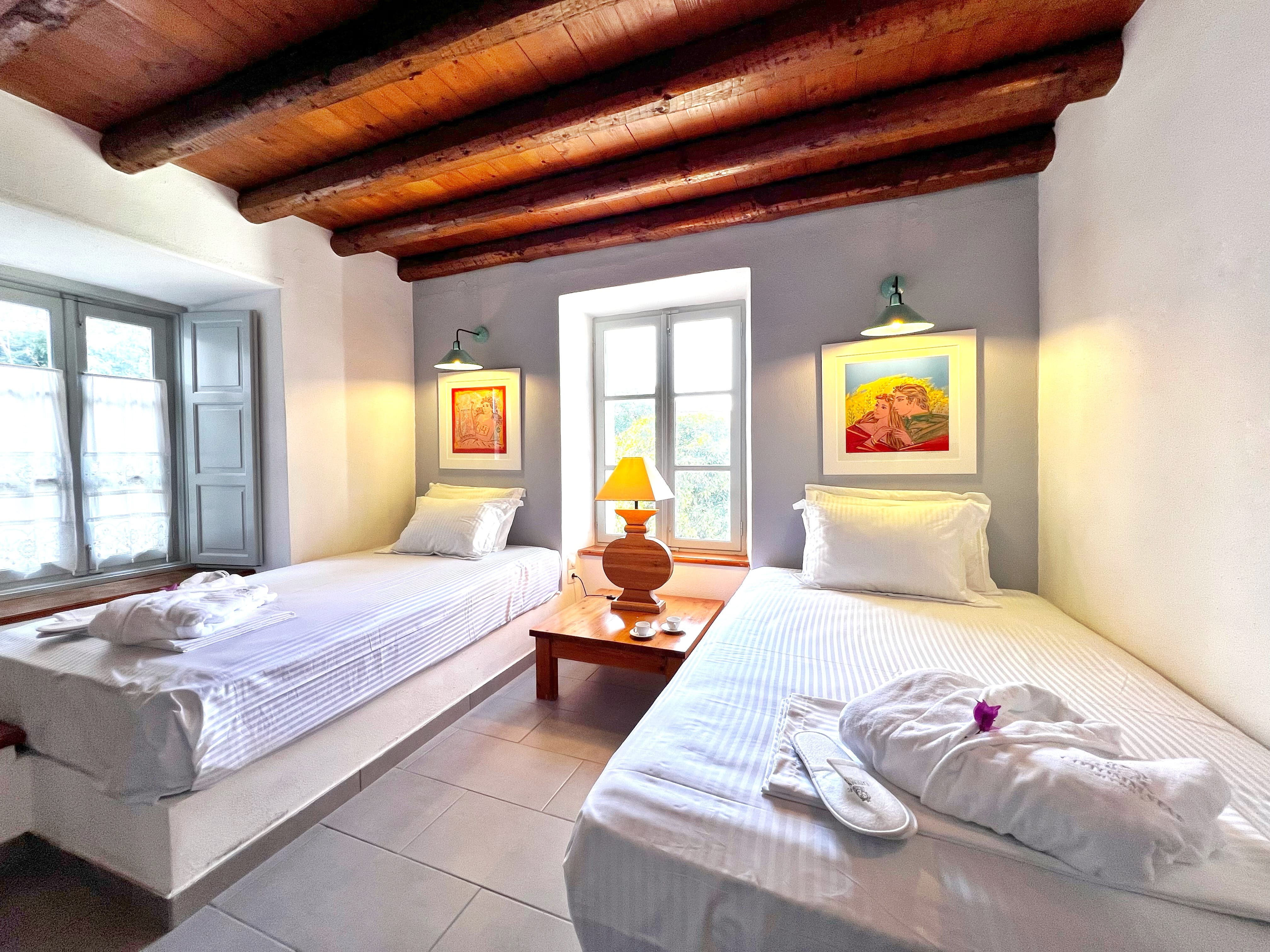 a couple of beds in a room