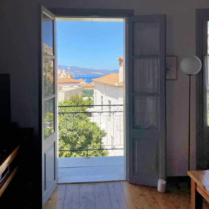 a view of a city through a glass door