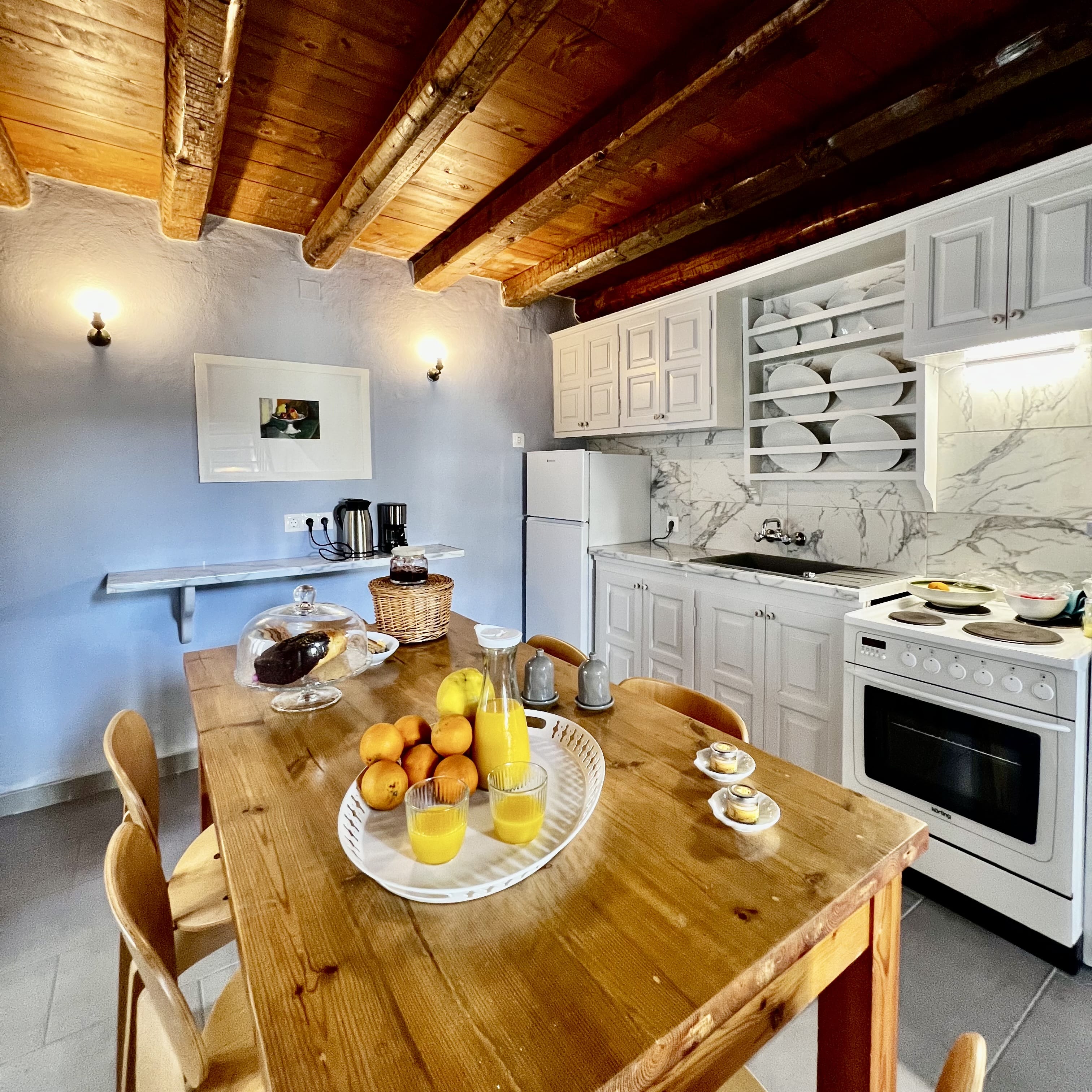 a kitchen with a table and a stove