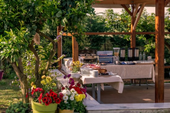 a patio with tables and chairs