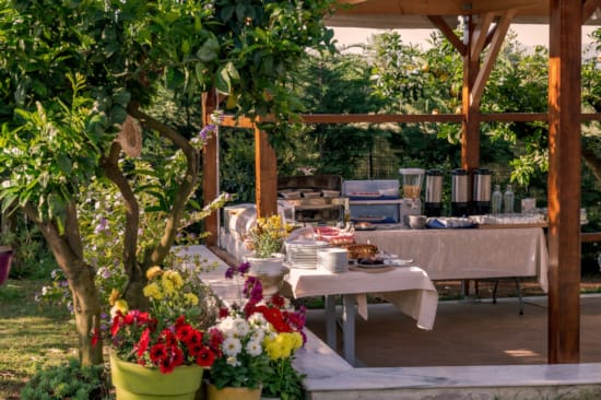 a patio with tables and chairs