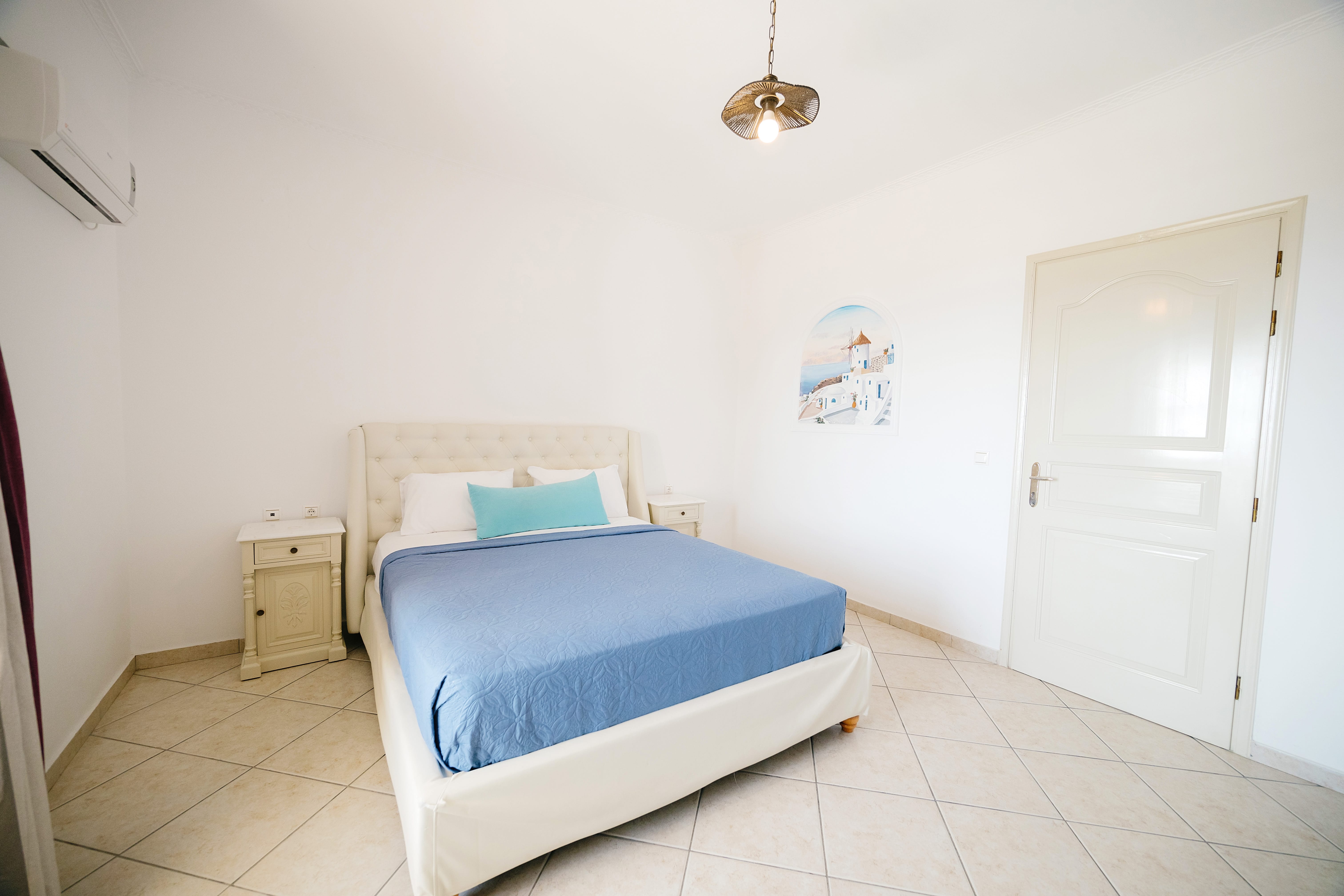 a room with a bed and a door