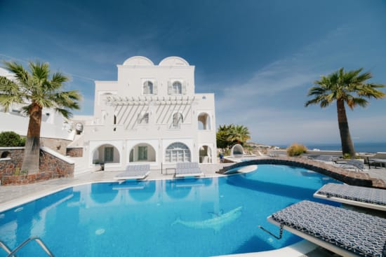 a white building with a pool