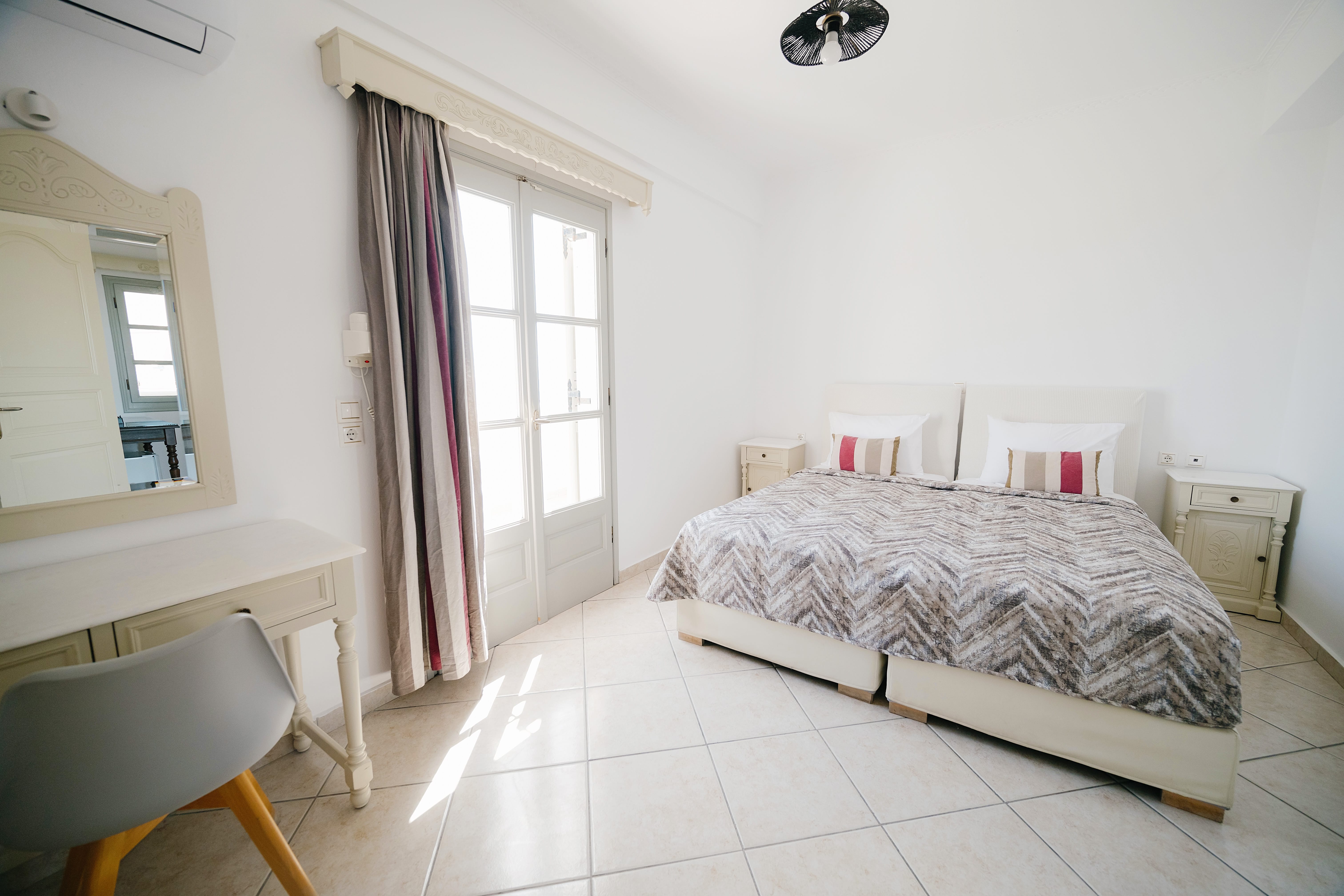 a bedroom with a bed and a chair