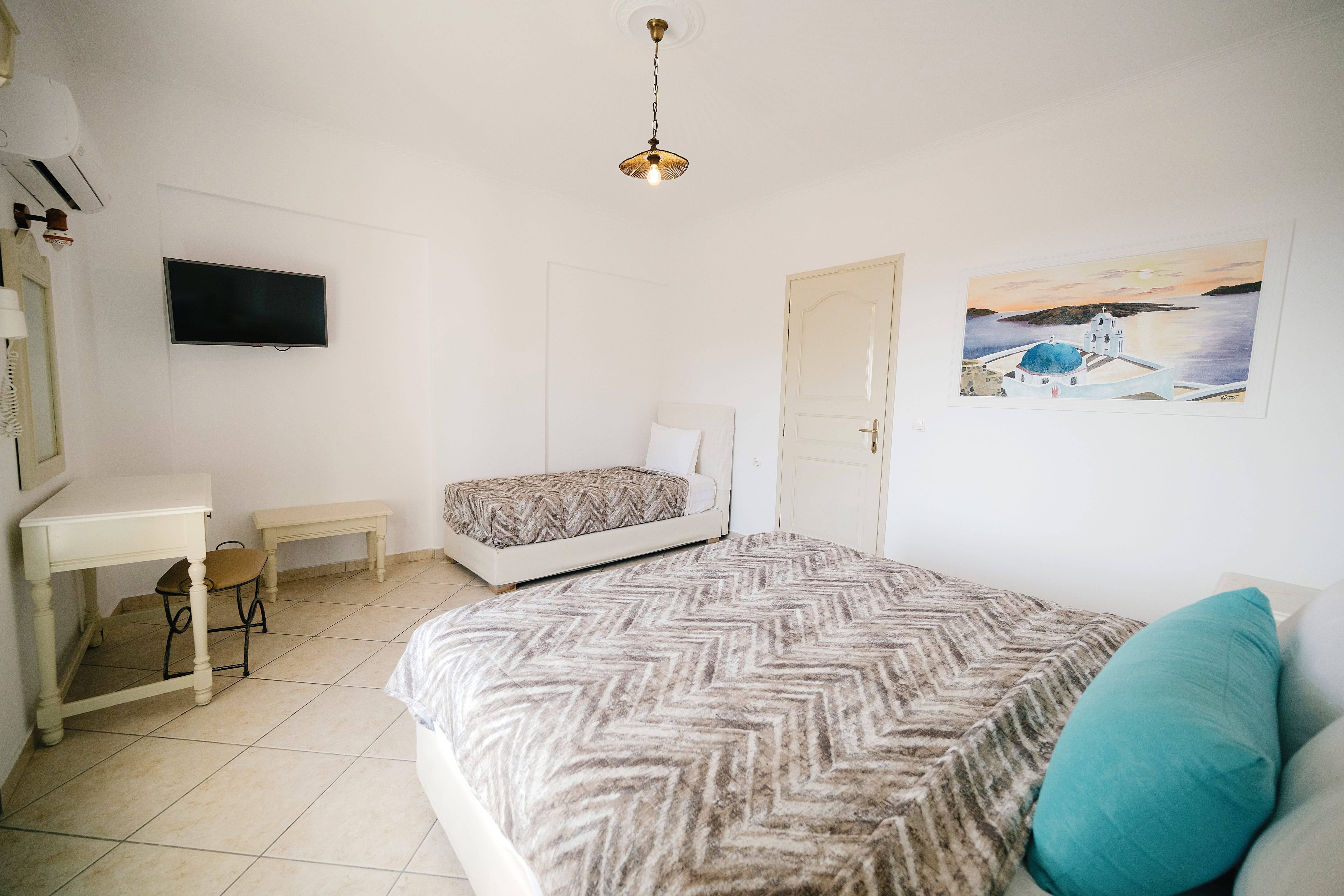 a bedroom with a bed and a couch