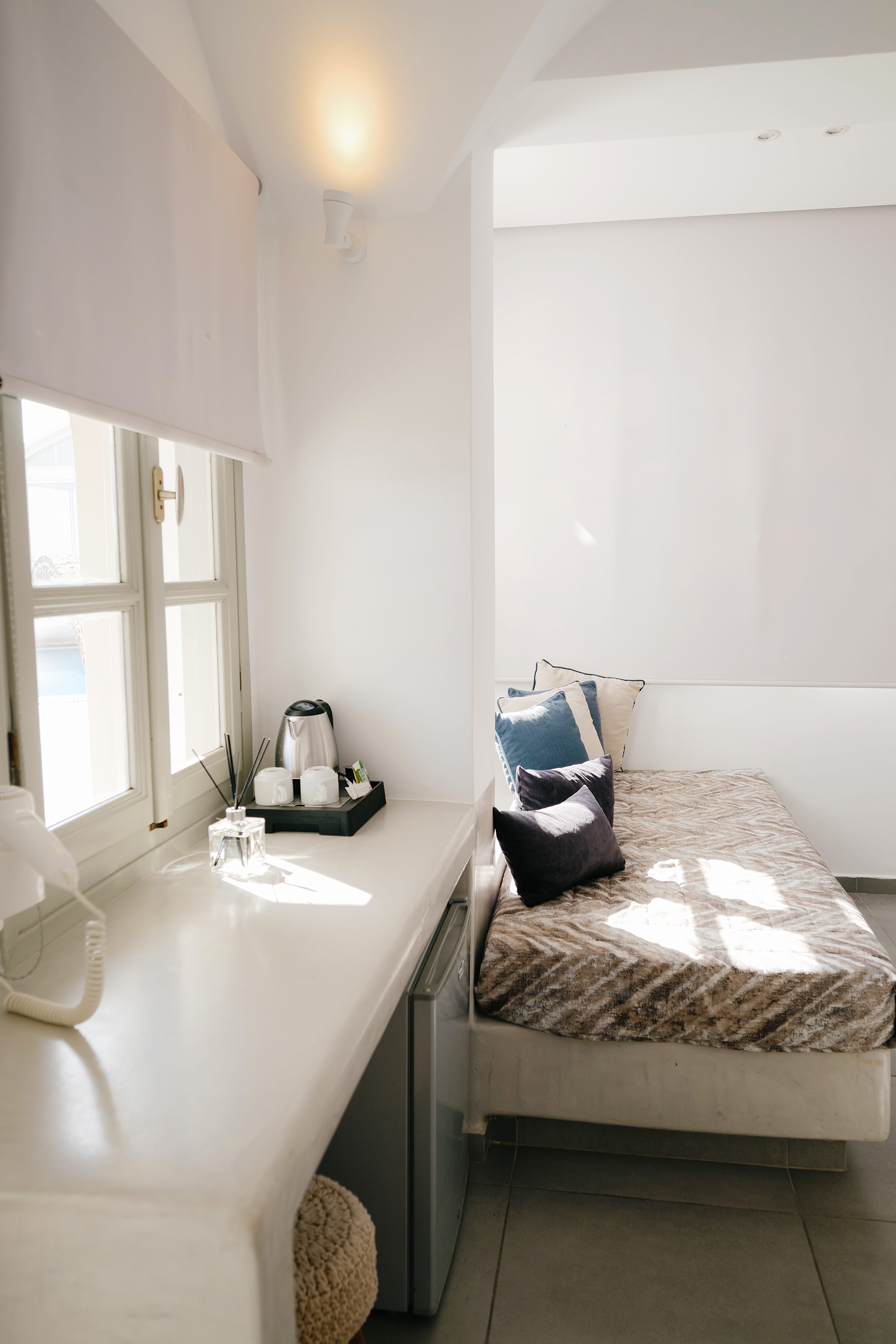 a bathroom with a bed and a sink