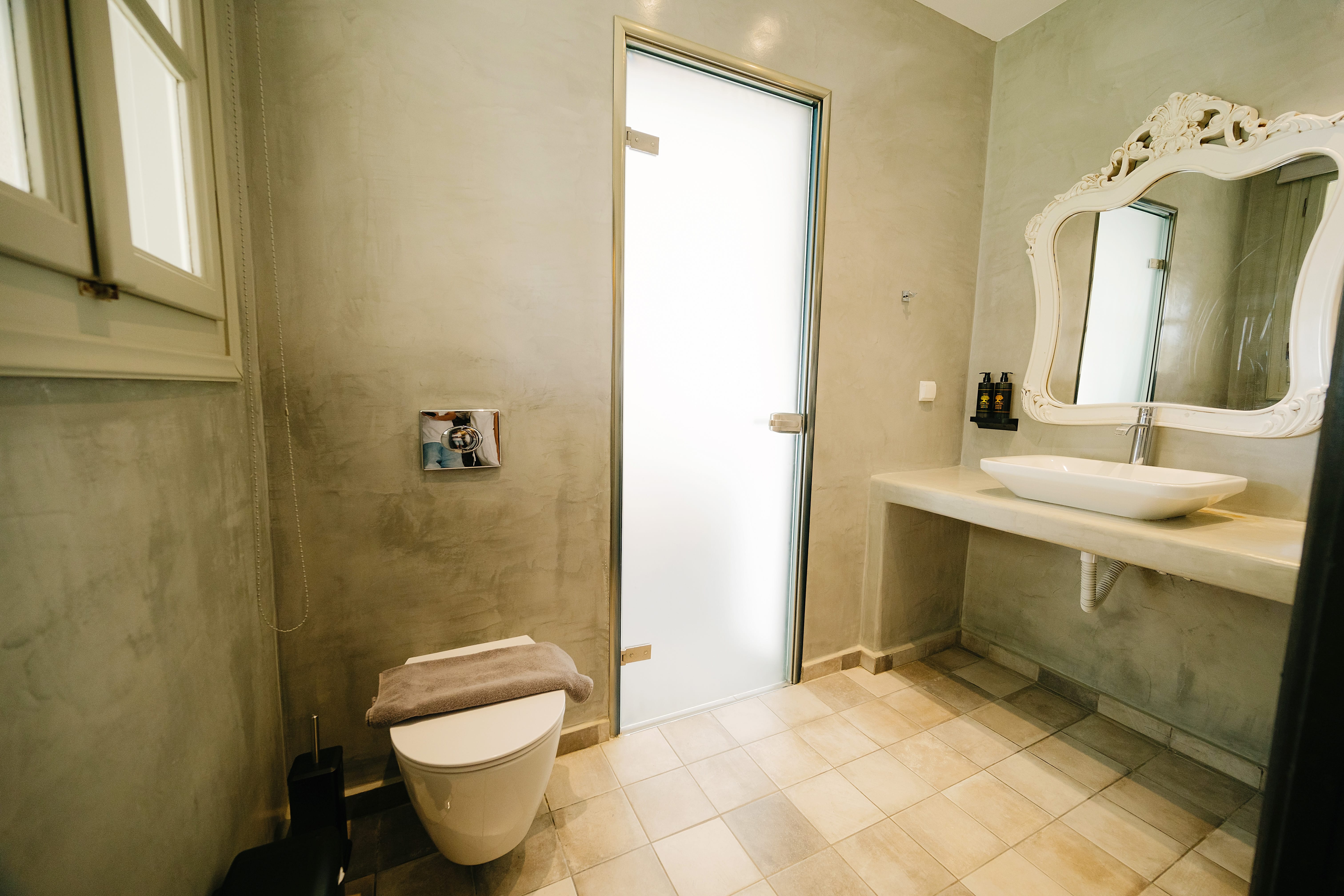 a bathroom with a toilet and sink