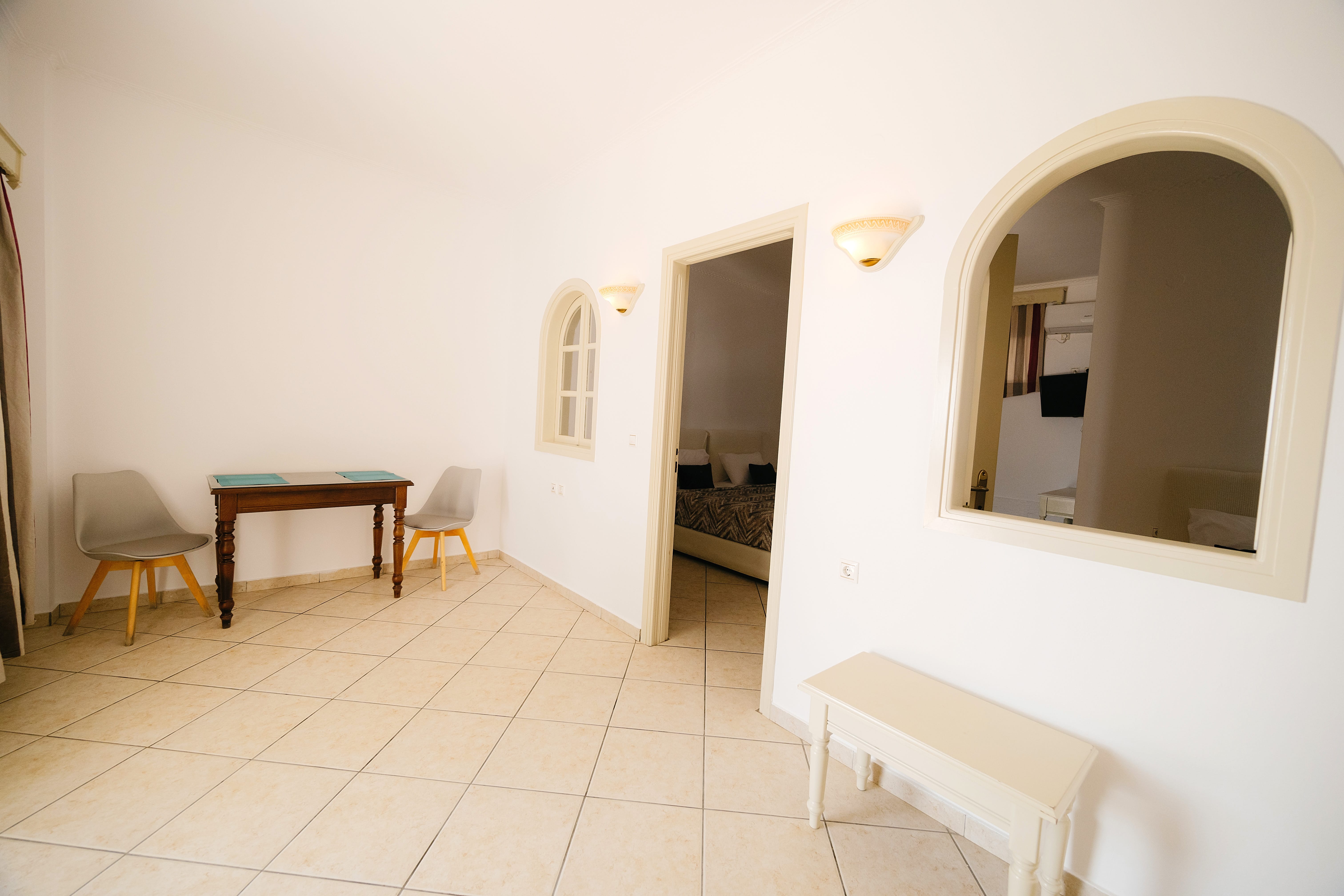 a room with a table and chairs