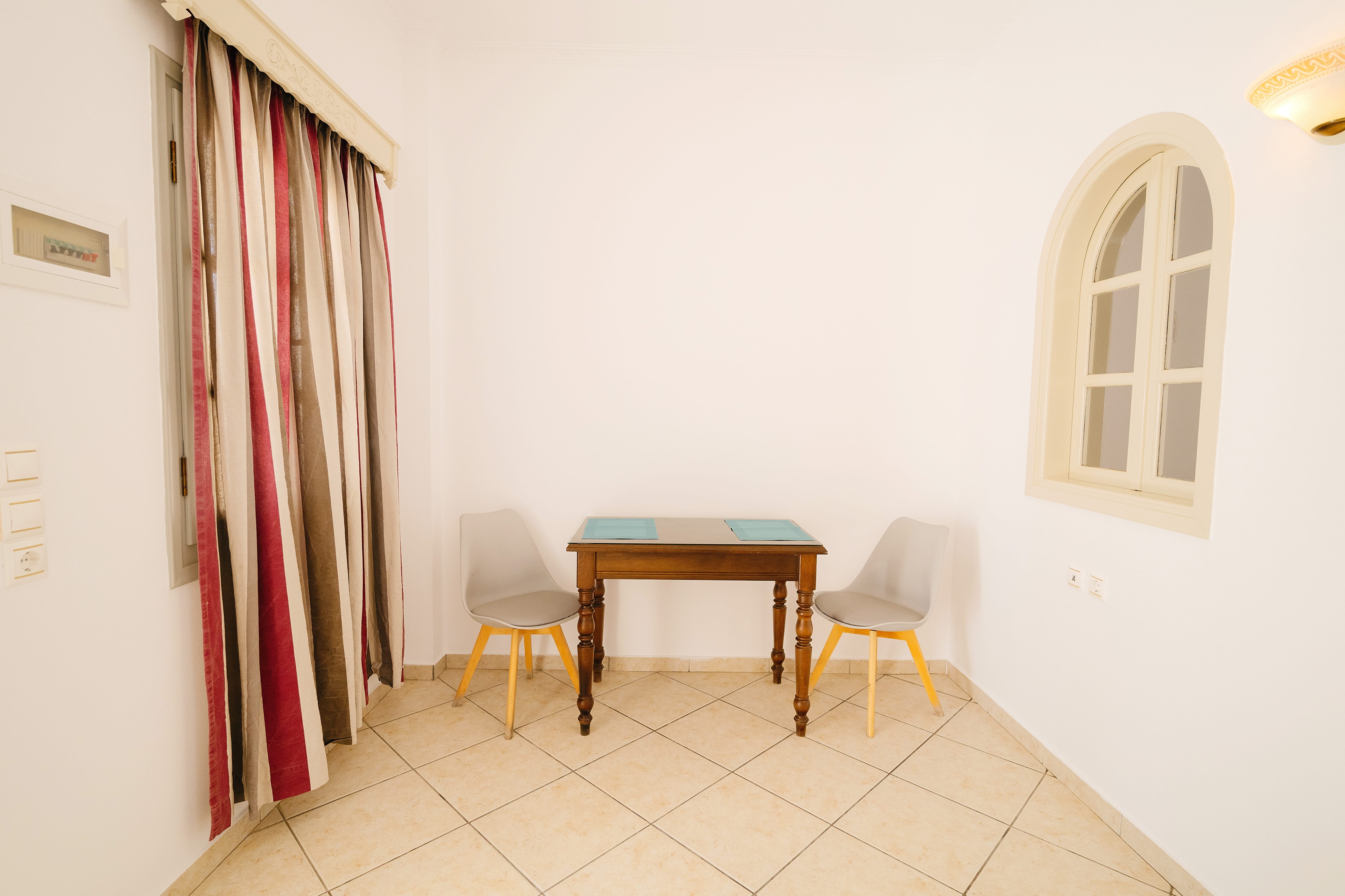 a room with a table and chairs