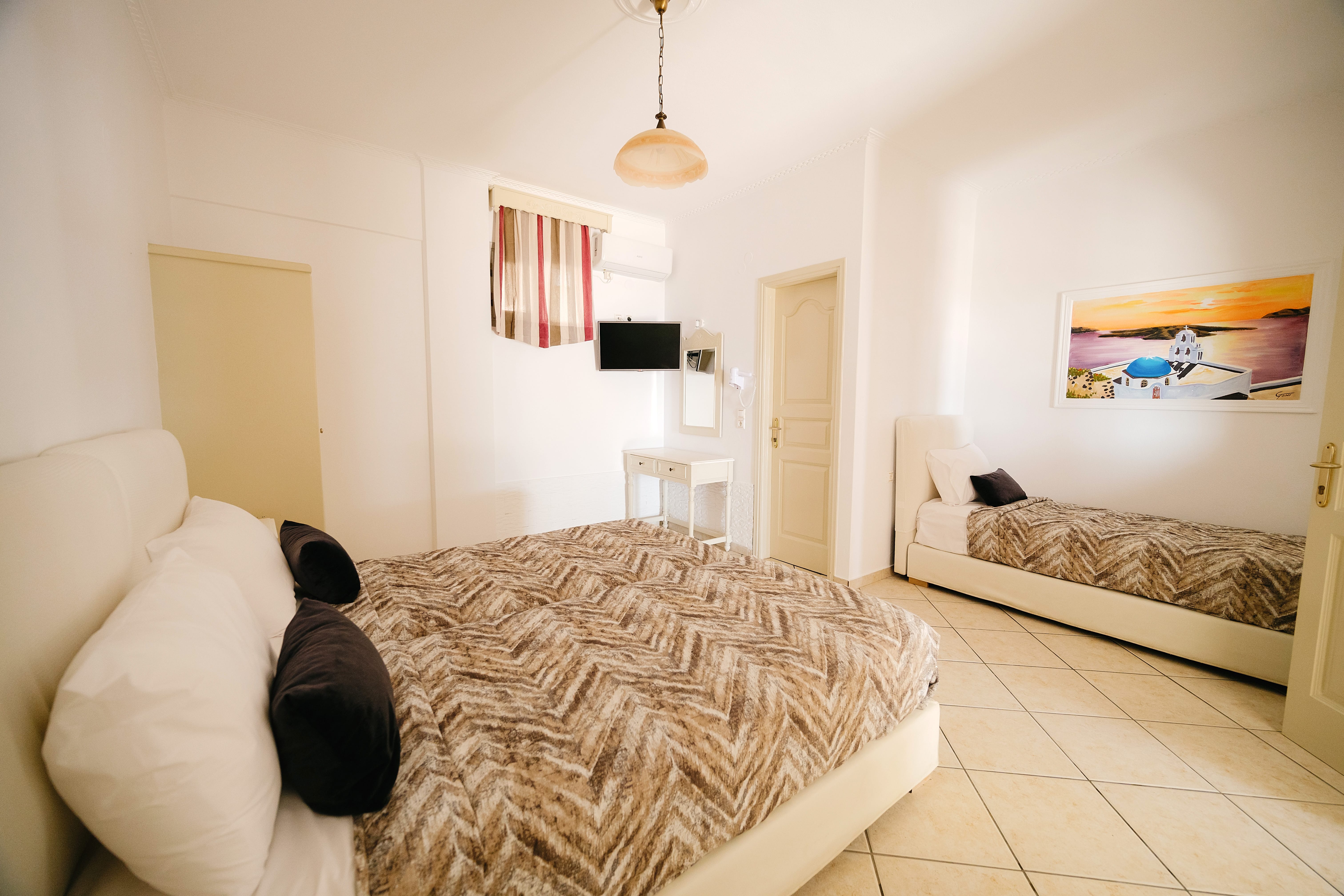 a bedroom with a bed and a couch