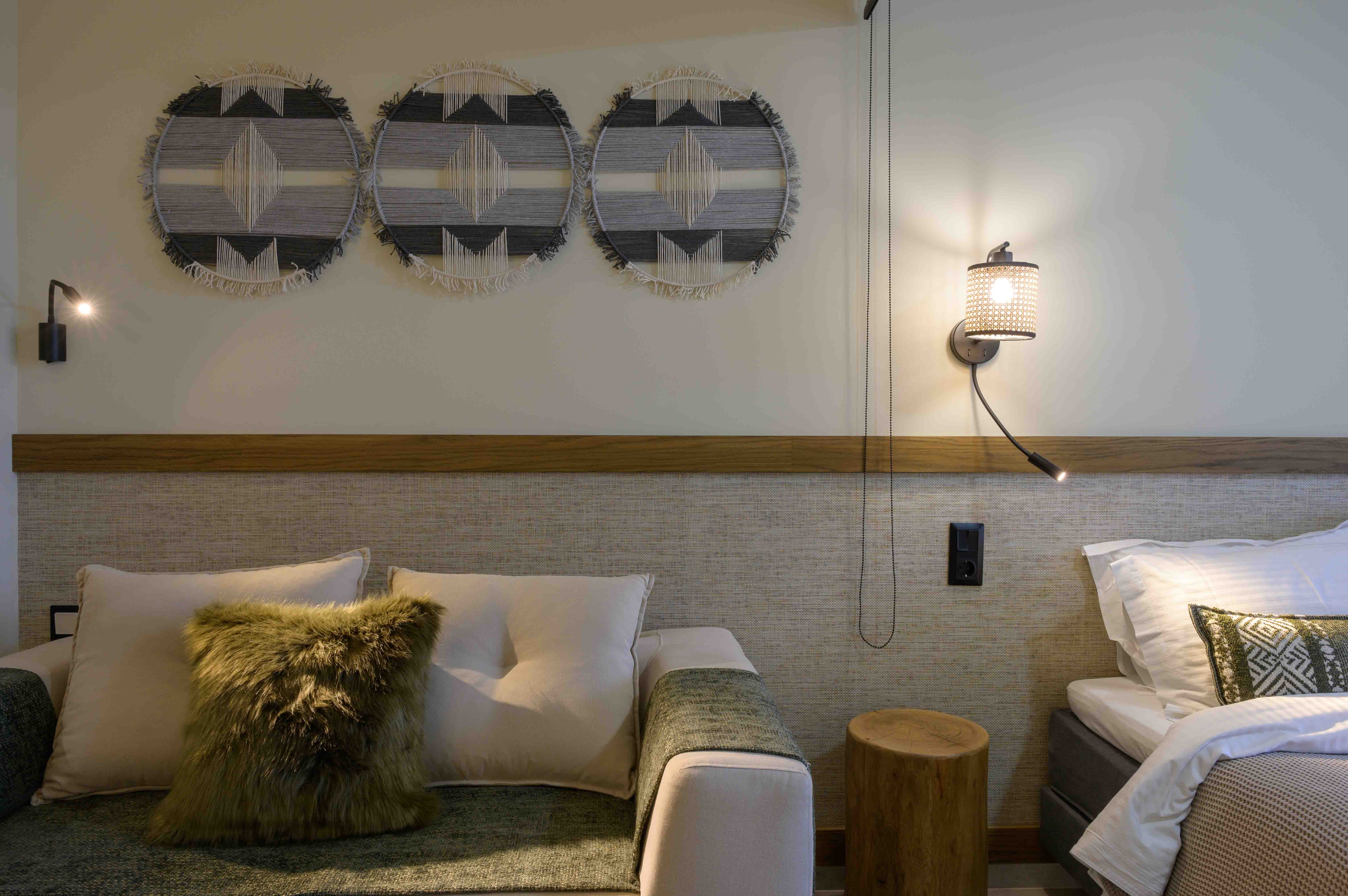 a bed with pillows and a lamp