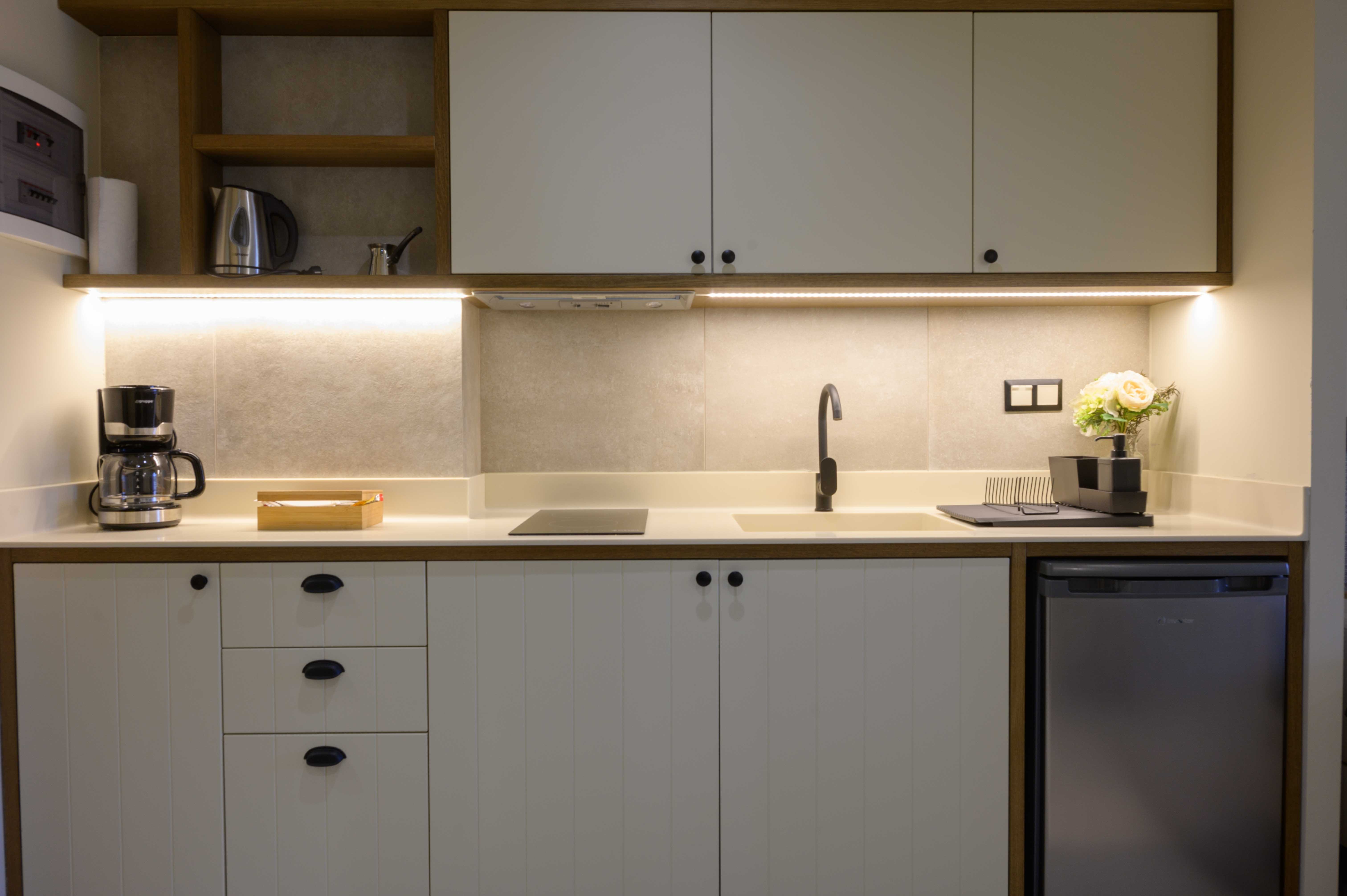 a kitchen with white cabinets