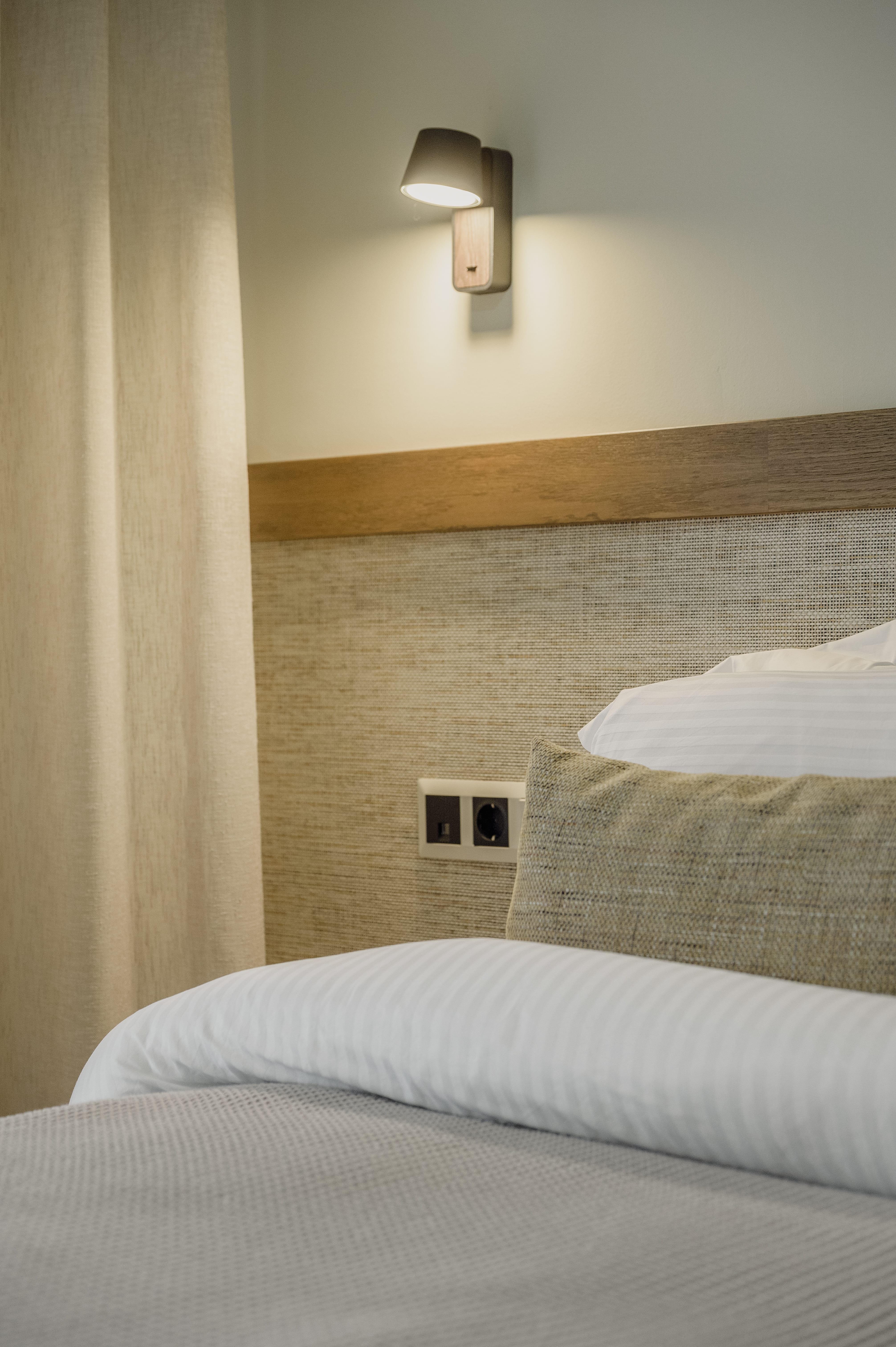 a bed with a lamp on it