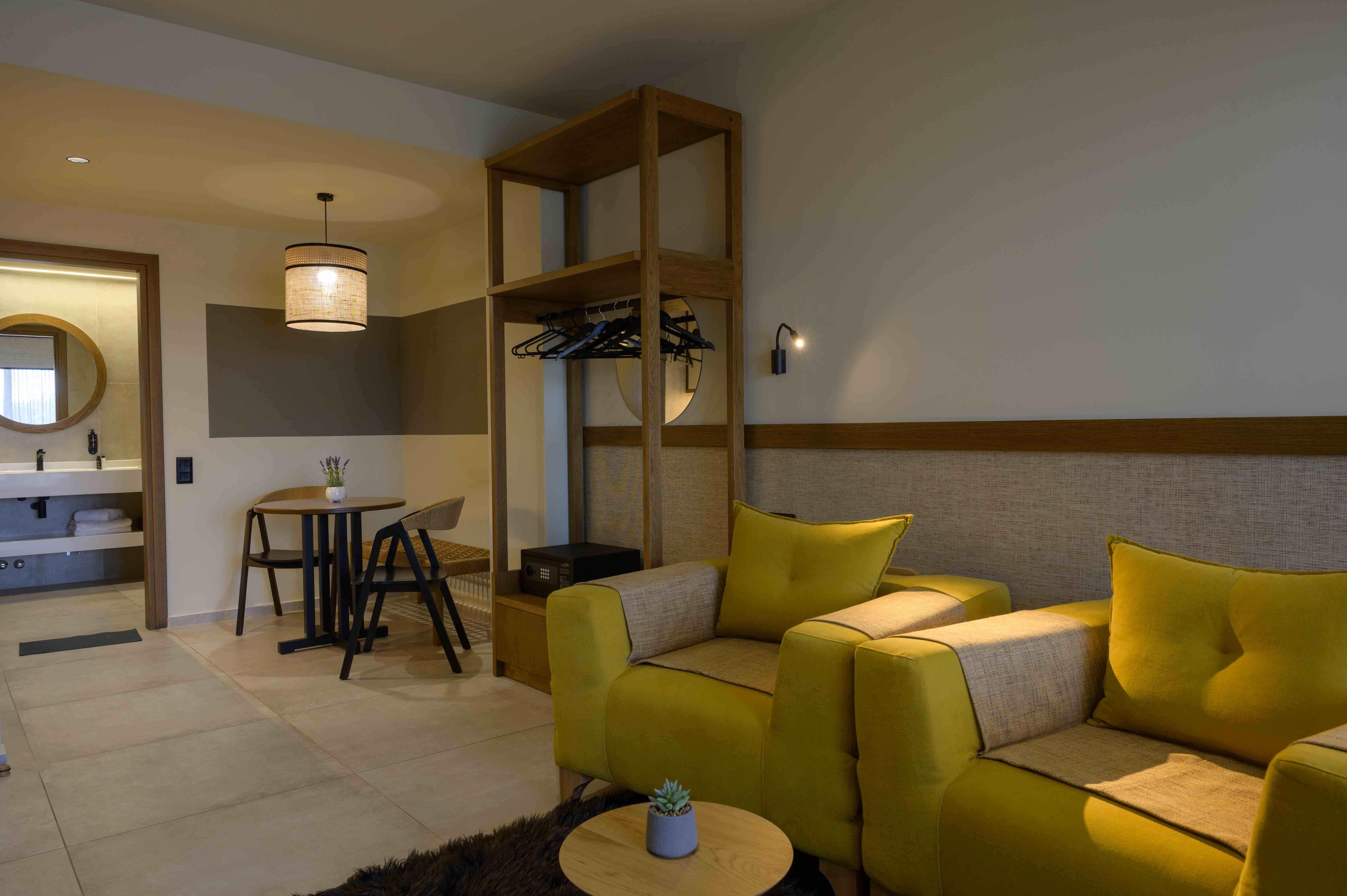 a room with yellow couches and a table