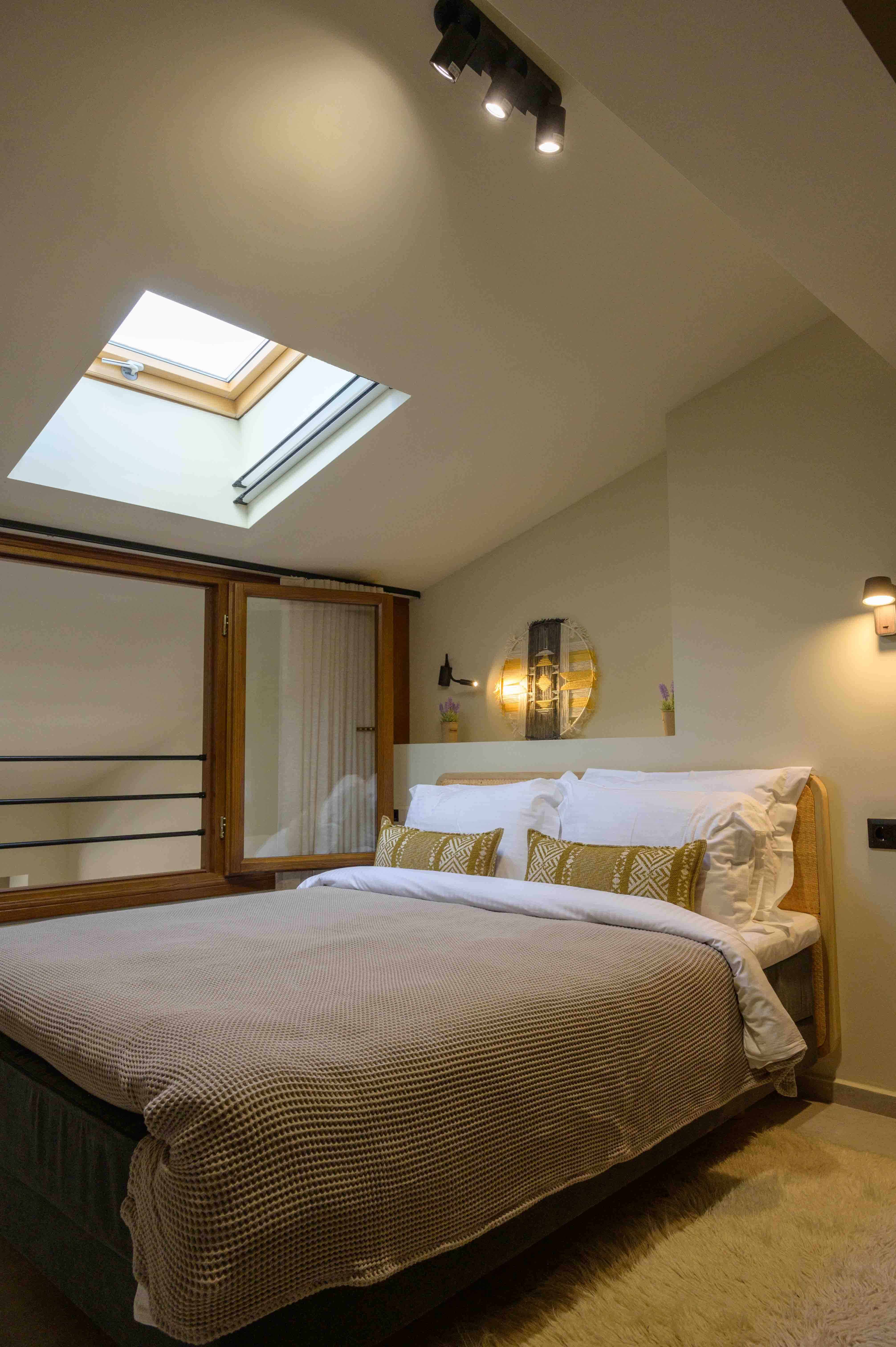 a bedroom with a large mirror