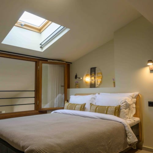 a bedroom with a large mirror