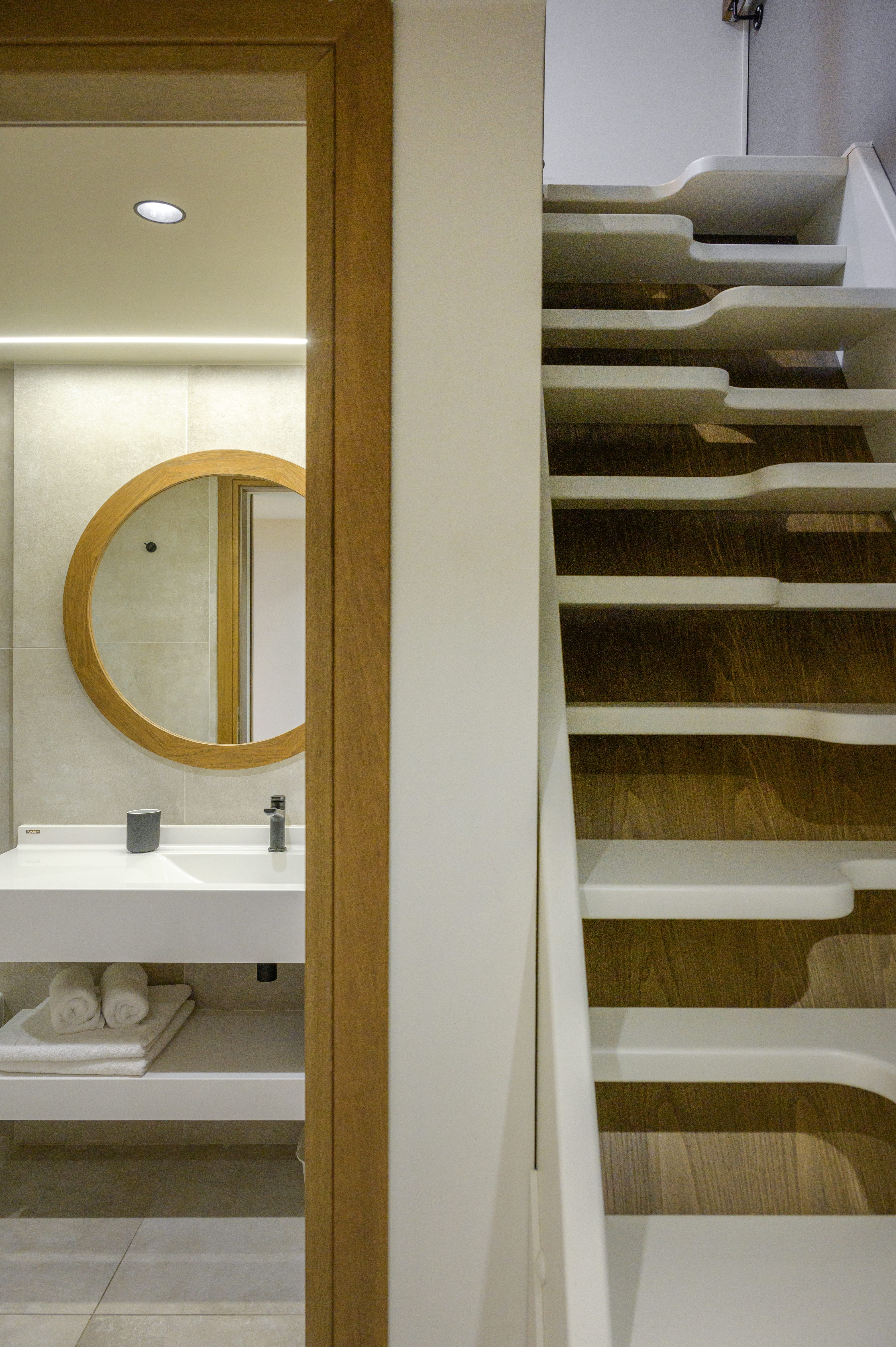 a bathroom with a mirror and a sink