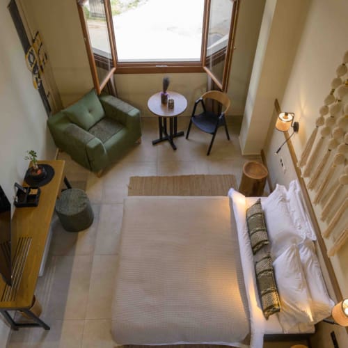 a bedroom with a bed and a couch