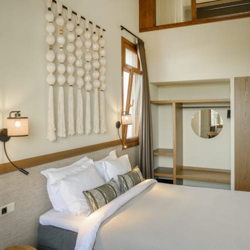 a bed with a white headboard