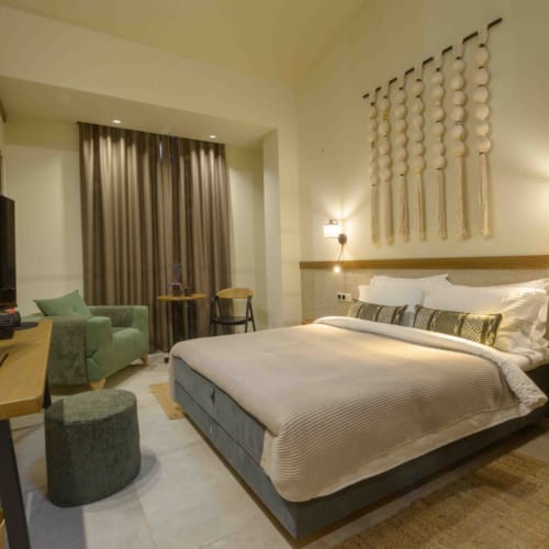 a bedroom with a bed and a desk