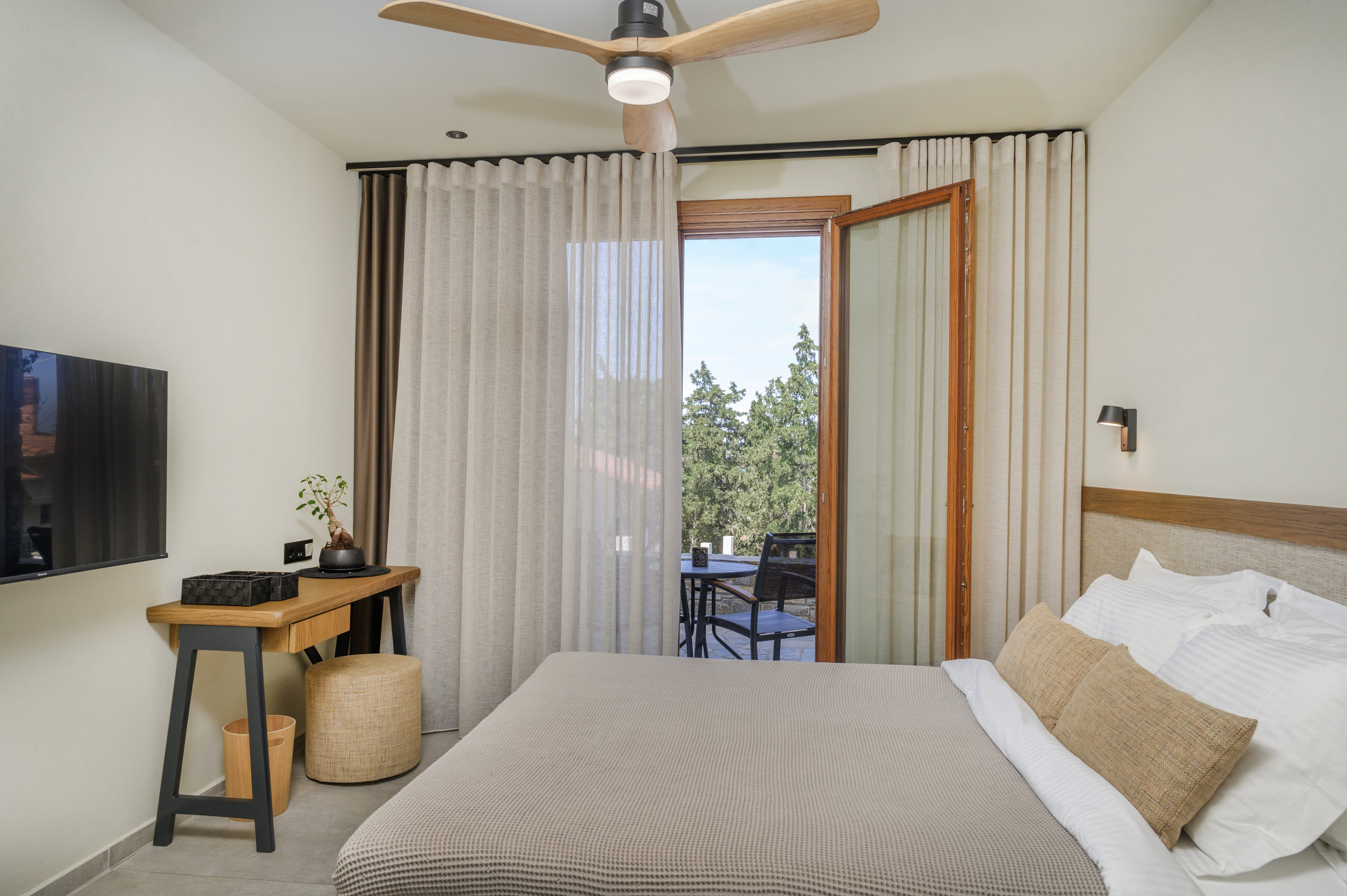 a bedroom with a large window