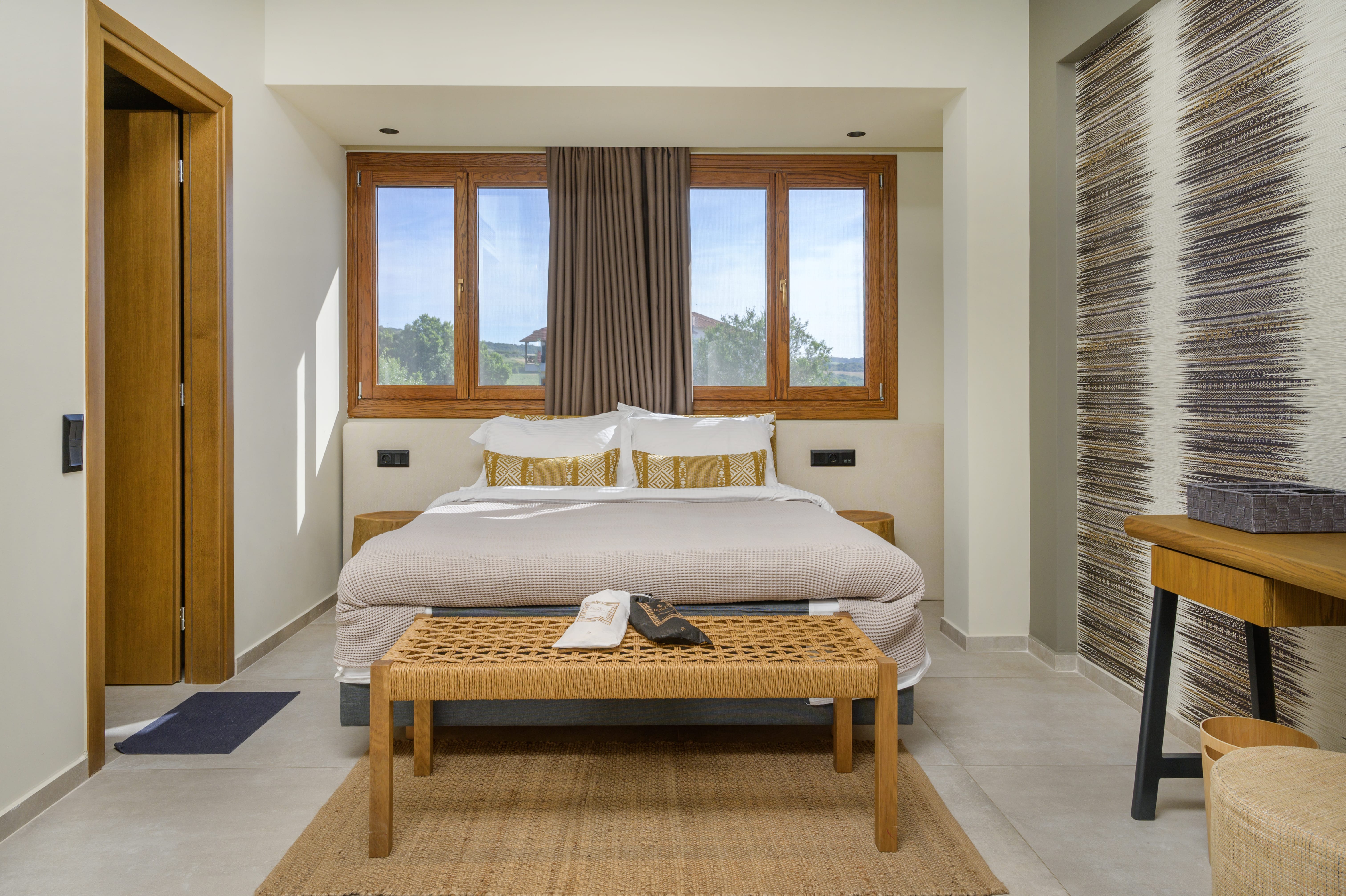 a bedroom with a large window