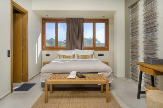 a bedroom with a large window