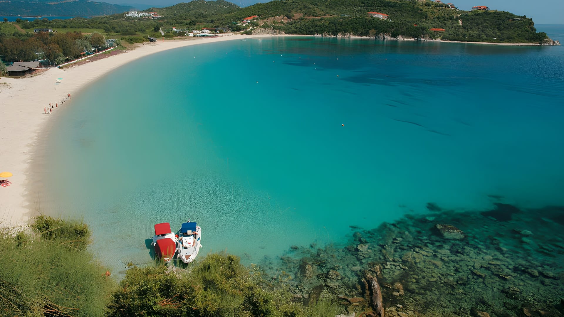 a blue water with boats on it