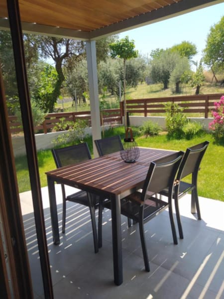 a table and chairs on a deck