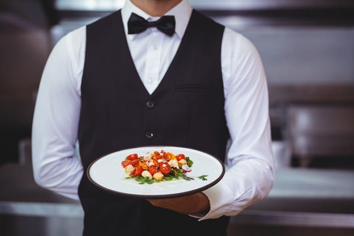 a man holding a plate of food