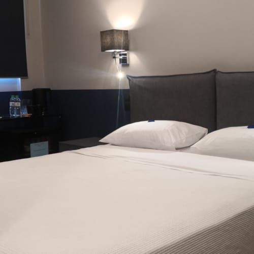 a bed with a white sheet