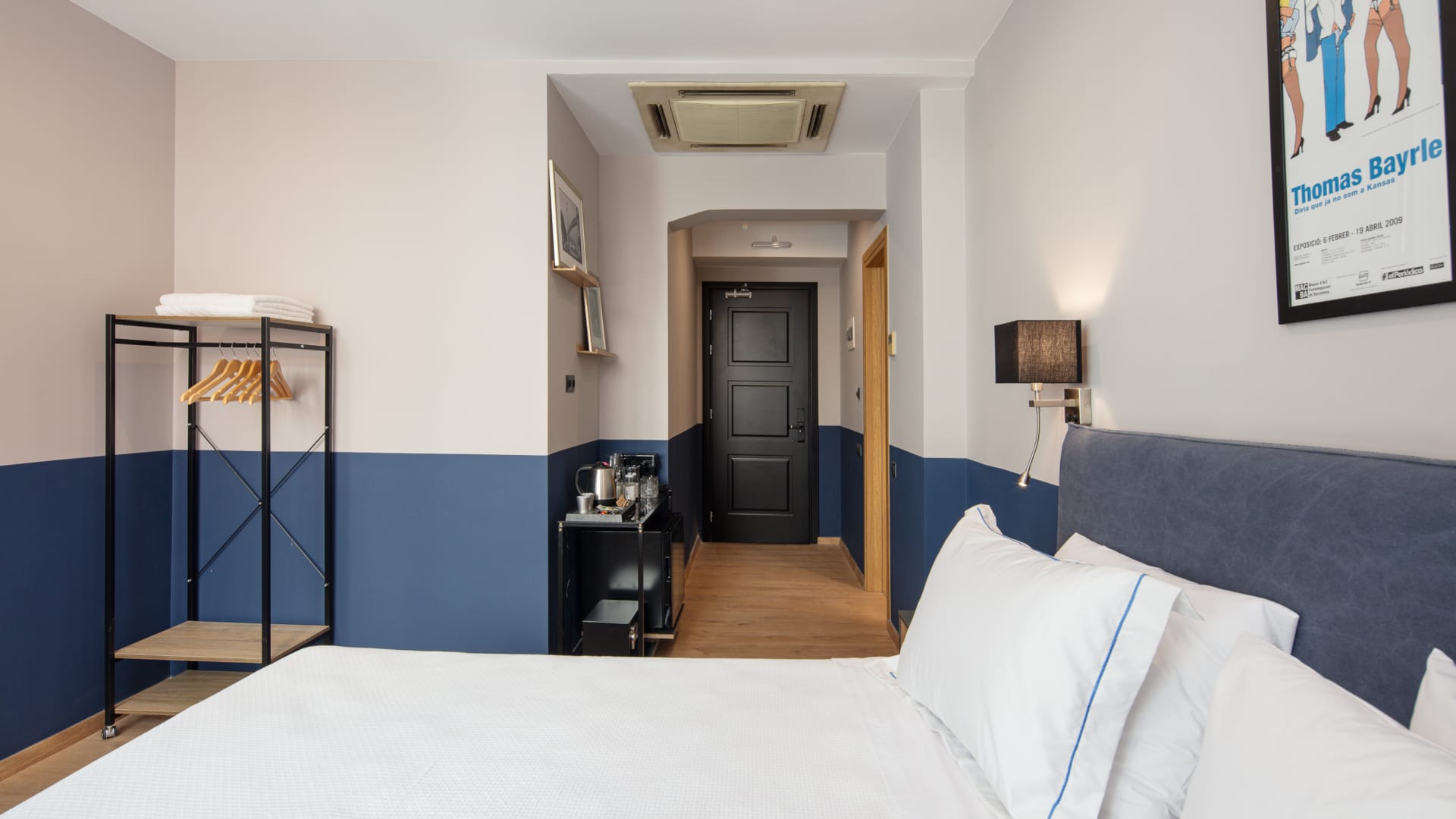 a bedroom with a bed and a door