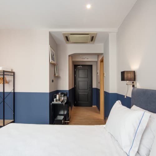 a bedroom with a bed and a door