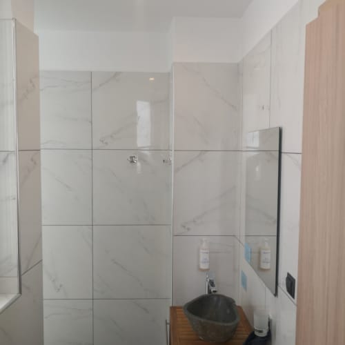 a bathroom with a sink and a mirror