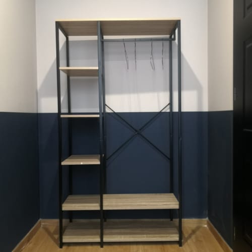 a black and white shelving unit