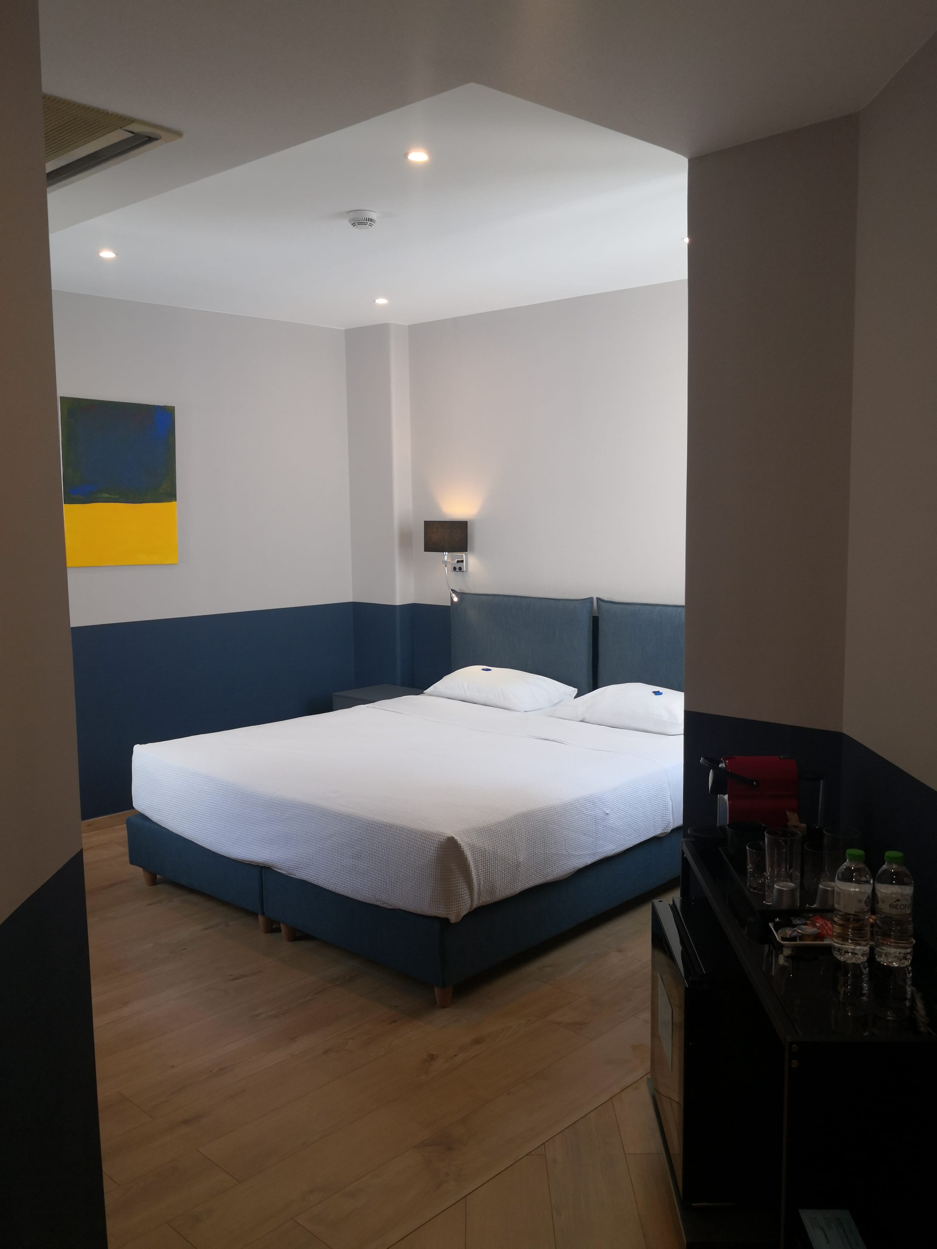 a bedroom with a bed and a table